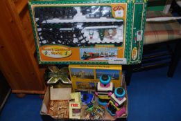 A quantity of toys including jigsaw, Santa train, cars, Berti Basset money box etc.