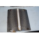 A tractor front grill, 17 1/2" wide x 19" high.