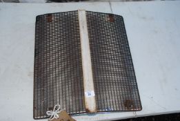 A tractor front grill, 17 1/2" wide x 19" high.