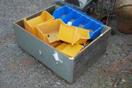 A wooden case of plastic Lin Bins in various sizes.