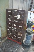 A 24 drawer metal cupboard, 30" x 16" x 54" high.