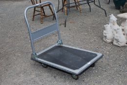 A collapsible aluminium trolley.