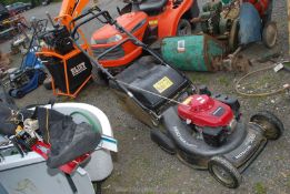 A Honda Easy Start HRH 536 lawn mower with roller, good working order.