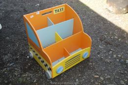 A wooden taxi book tidy.