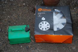 A set of four 15'' wheel trims and a plastic petrol can.