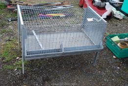 A galvanised Chicken Coop with feeders, 38'' x 20'' x 26'' high with removable dump tray.