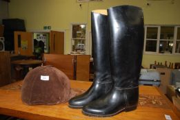 A Champion riding hat size 6 7/8 and a pair of size 7 riding boots.