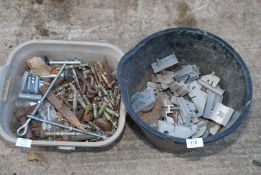 A bucket and bowl of rawl bolts, expanding bolts, plastic and enamel fixings, etc.