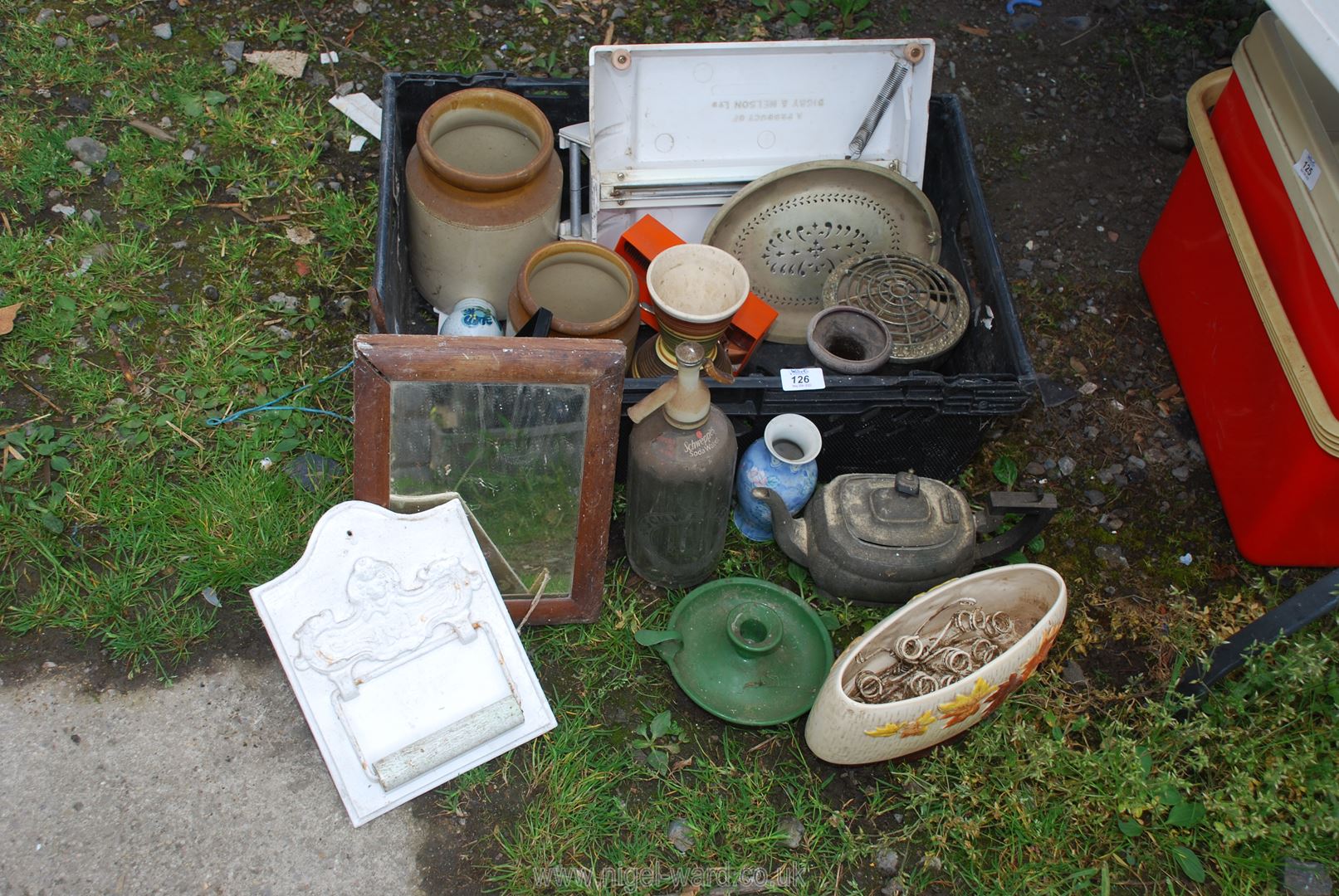 An old soda syphon, toilet roll holder, vase etc.