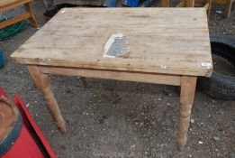 A pine table, 41'' x 27''.