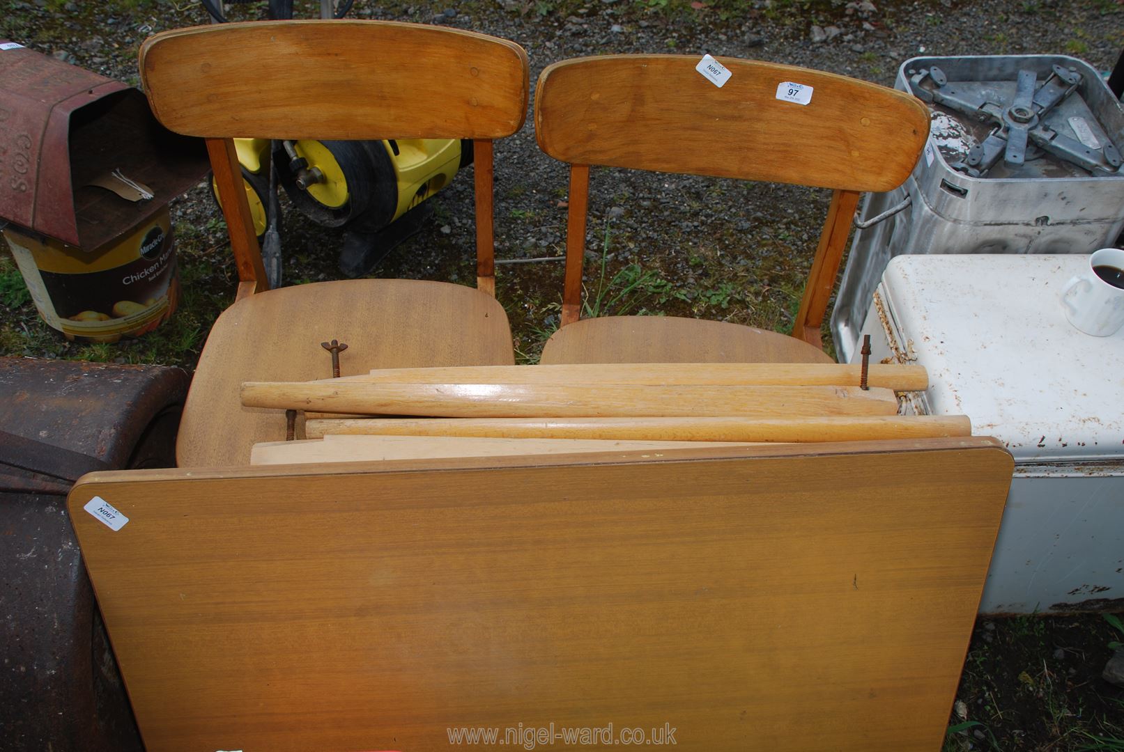 Two wooden chairs and a small table.