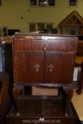 A darkwood pot cupboard.