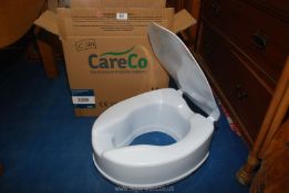 A boxed CareCo mobility toilet seat.