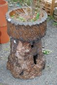 A log effect planter.