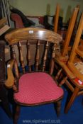 A dark wood spindle back kitchen chair