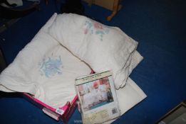 A pair of single bed quilted bed throws and pillow shams