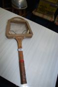 A vintage Dunlop tennis racket with press.