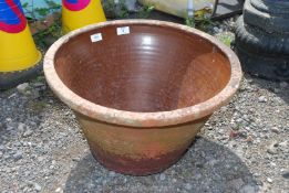 A terracotta salt glazed planter.