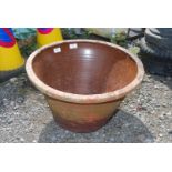 A terracotta salt glazed planter.