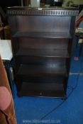 A darkwood set of adjustable bookshelves 52" tall.