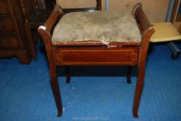 A darkwood piano stool and contents including needlework items.