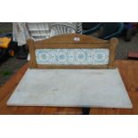 A marble washstand top with tiled back, 30'' wide x 18'' deep.
