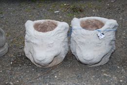 Two lion head planters.