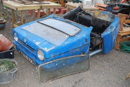 A blue Reliant Robin body for spares and repair.