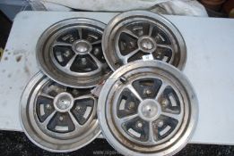 Four car wheel trims possibly for Triumph 2000, 14 3/4" diameter.