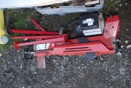 A log splitter a/f on trolley legs, (sold as seen).