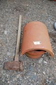 A sledge hammer and a terracotta chimney cowl.
