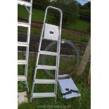 A five rung aluminium stepladder.