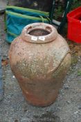 A terracotta urn, 24'' high.