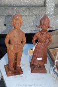 Two cast iron fire companion holders in the form of Dutch figures.