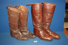 Two pairs of Riding boots in brown leather, one pair by Alan Mcafee Ltd.