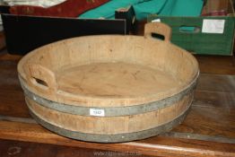 A large oak barrel base made into a carrying tray with 2 handles 24" diameter x 6 1/2" tall.
