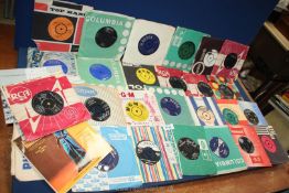 A box of 45 rpm records to include; The Who, Small Faces, Beatles, etc.