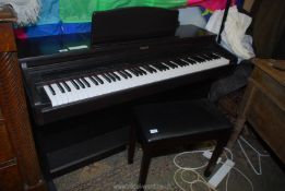 A dark Rosewood finished Roland HP237e Digital Piano having a 6 1/2 octave keyboard and complete