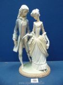 A Lladro 'Walk in Versailles' figure of gentleman and lady in renaissance dress.