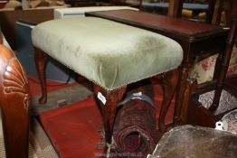 A circa 1940 cabriole legged Dressing Stool having an olive green velvet typed over-stuffed