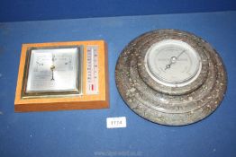 A marble Barometer and a wooden framed Barometer/thermometer with winter and summer readings.