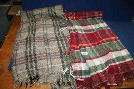 A Pure Wool throw Made in Scotland a/f., plus a red/green throw with fringing.
