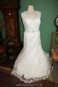 A 'Symphony of Venus' Wedding dress with netted straps and lace overlay, button back, large size.