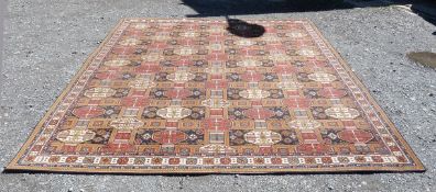 A large Wilton 'Ambala' Carpet, with lozenges in reds, blue and brown, 9' 1'' x 10' 7'' approx.