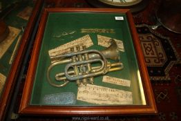 A musical display cabinet displaying 'the bugle call march' (bugle a/f),