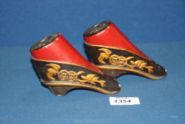 An unusual pair of Chinese wooden and lacquer 'bound feet' model shoes, 4" x 3 1/4" high.