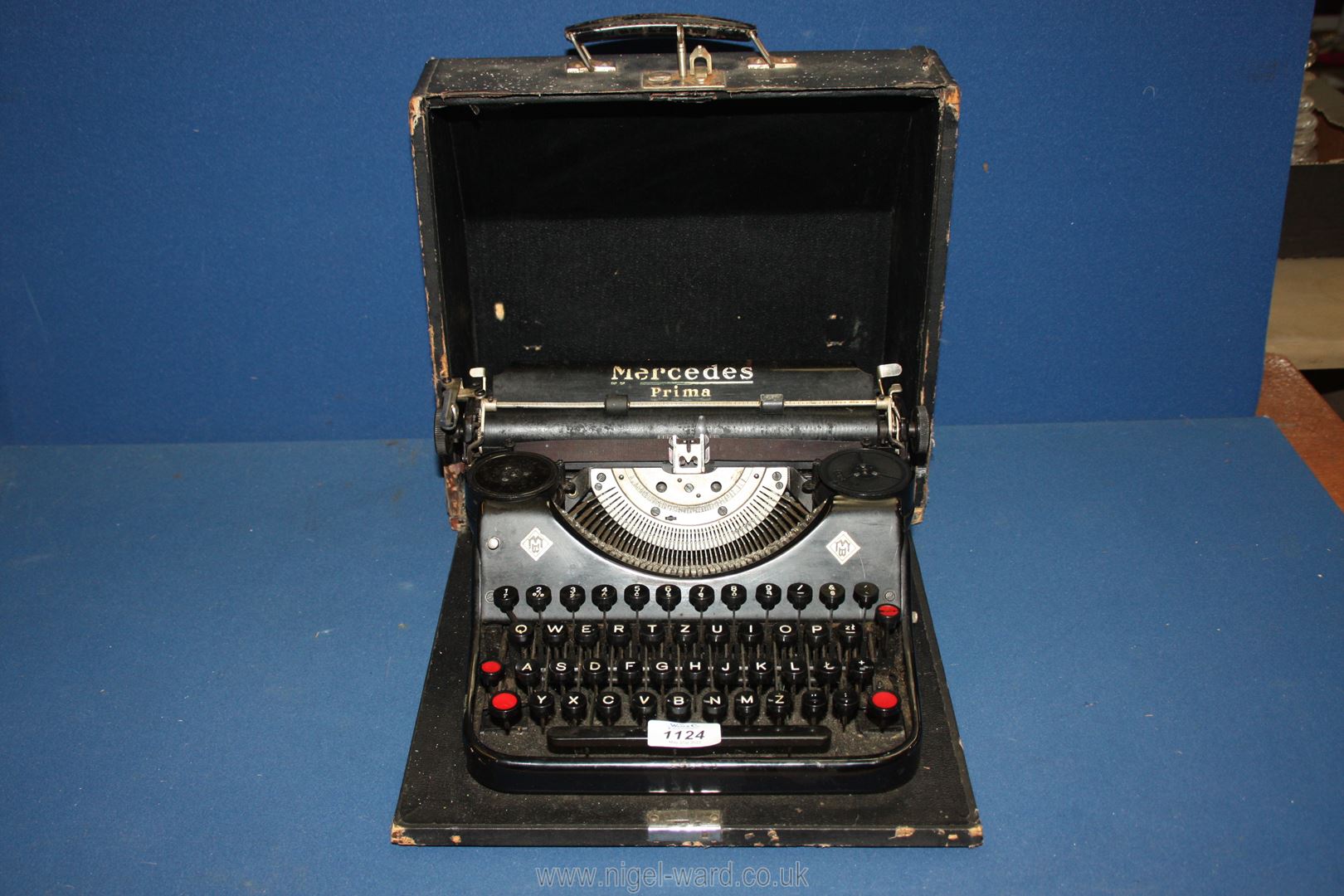 A cased Mercedes Prima typewriter with key, 12'' x 13''.