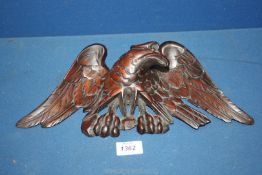 A George III carved wood eagle surmount, damage to back especially wing, 14" wide x 6 1/2" high.