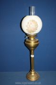 An Oil Lamp with reeded brass base,