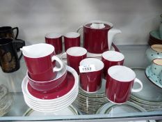 A Thomas, Germany teaset in burgundy and white including six cups and saucers, teapot, milk jug,